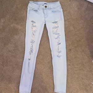Light blue skinny ripped jeans
